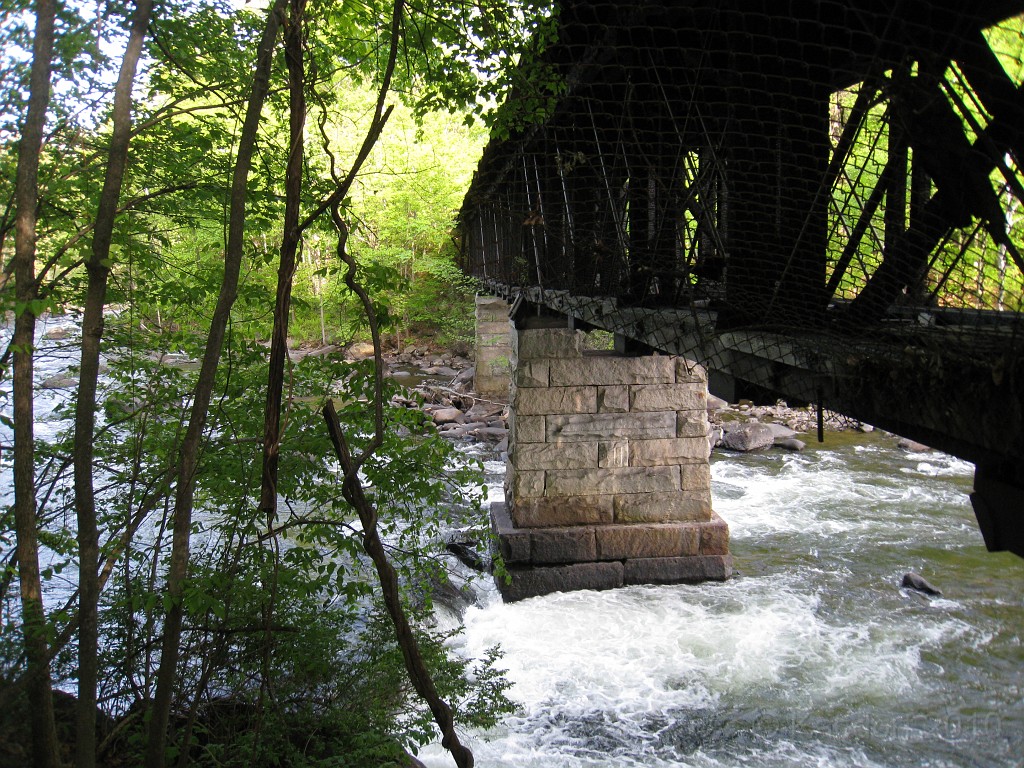 Tilton NH Rail Trail 2010 0200.jpg - Winnipesaukee River Trail, Franklin New HampshireTrestle View ParkInterested in taking a walk or bike ride on a scenic historic trail close to the downtowns of the twin rivers area, yet with the feel of wilderness. A 3 mile trail parallels the Winnipesauke river and passes the historic Sulphite upside down covered bridge believed to be the only one in the country and listed on the national register of historic places. You will also view mill ruins and remaining portions of dams that tell the history of the 5 mills that operated on this river in the mid 19th century.